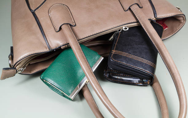istock Purse and wallet out of a handbag 1128994574