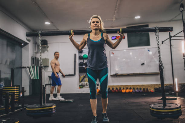 istock Woman working out at the gym 1128995798