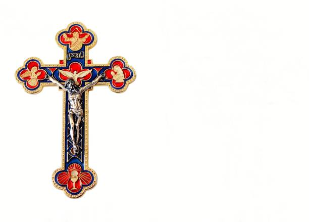 istock Coloful metal crucifix isolated on white 1128996484