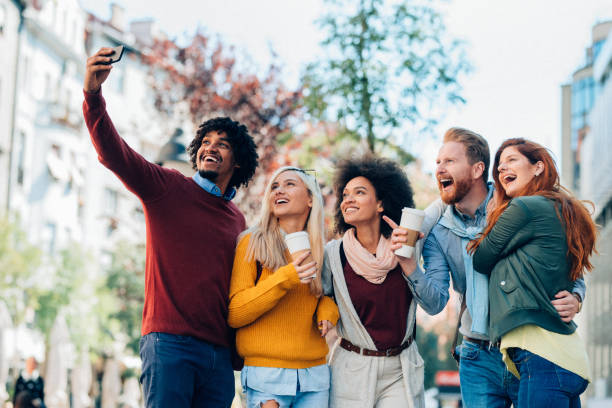 istock International friends taking selfie 1128996777