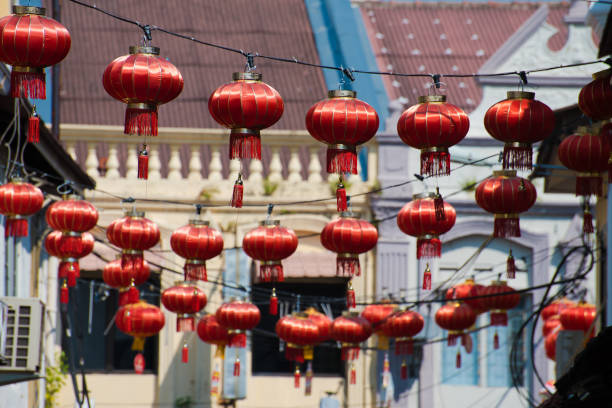 istock Rows of red lanterns decorations at colourful pre-war heritage buildings during Chinese New year, Malacca, Malaysia. 1128997767