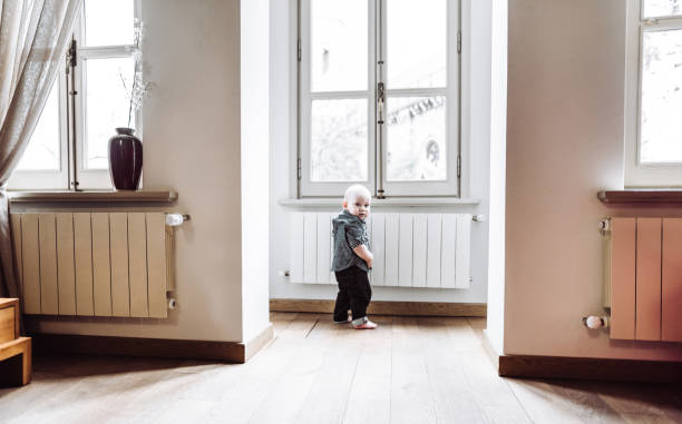 istock little kid walking alone at home 1128998140