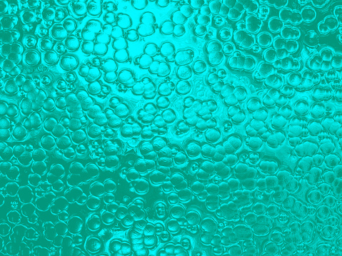 Abstract of colored drops on the glass with colored background