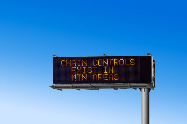 A Smart Motorway highways signs stating a 40 mph miles per hour speed limit and stating a lane is closed on a sign and a Red Cross highlighting it