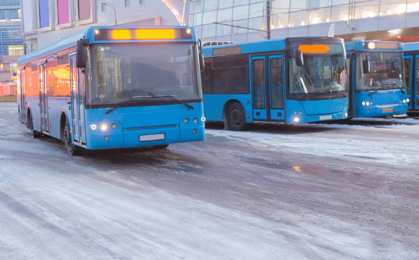 istock buses in the winter at the bus station 1128999050