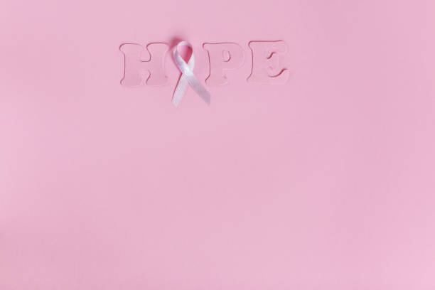 istock Lilac ribbon with word Hope on pink background 1128999728