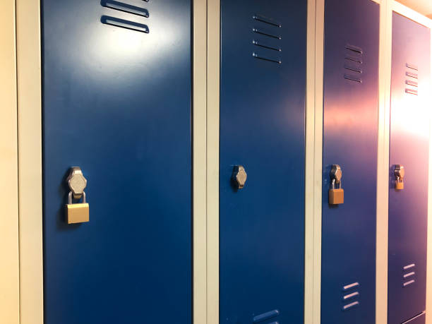 istock Industrial changing drawers, lockers with a blue doors. Some are locked with padlocks 1129002509