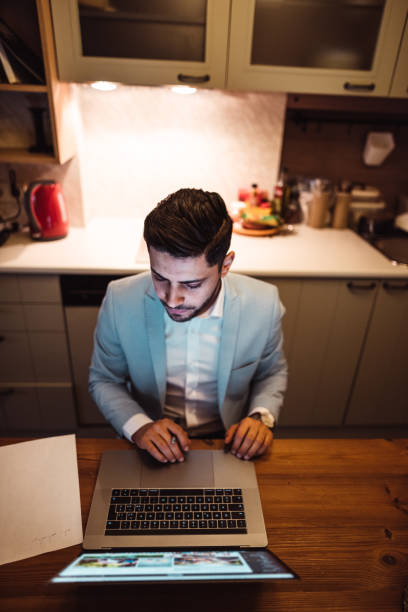 istock businessman working at home with laptop 1129002605