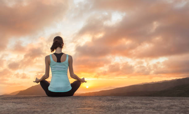istock Peaceful meditation at sunrise 1129005417
