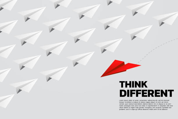 istock red origami paper airplane go different way from group of white. 1129007465