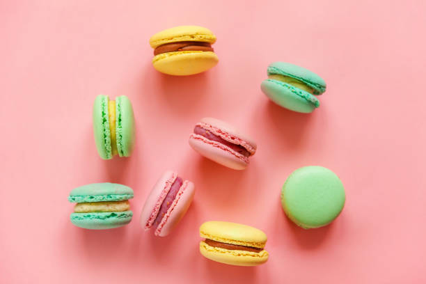 istock Colorful macaron on pink background 1129015344