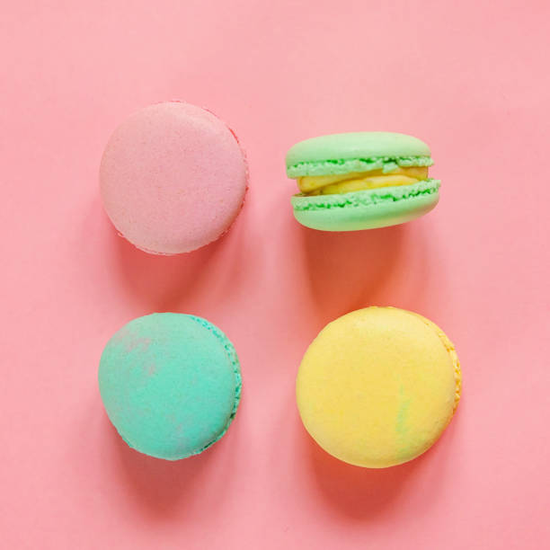 istock Colorful macaron on pink background 1129015423