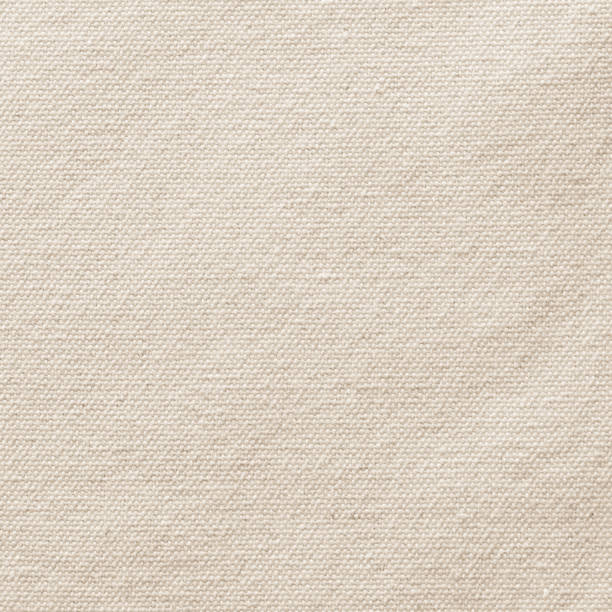 Beige canvas burlap texture background in light sepia brown with cotton fabric pattern for arts painting backdrop, sacking and bagging design Beige canvas burlap texture background in light sepia brown with cotton fabric pattern for arts painting backdrop, sacking and bagging design woven fabric photos stock pictures, royalty-free photos & images