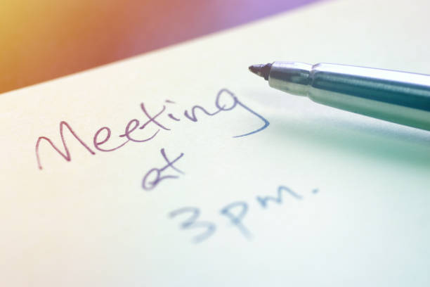 istock Meeting Reminder Written with a Pen on Sticky Note 1129023685