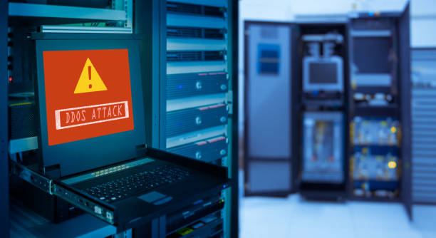 " DDOS ATTACK " and Alert icon on display of computer for management server in data server room stock photo