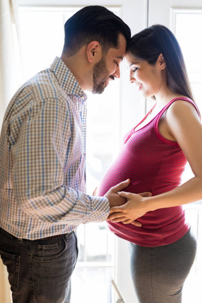 istock Loving Latin Couple Expecting Baby 1129026135