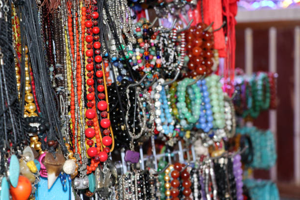 istock Bead necklace or rosary, threading from a rounded small piece of stone and silver material. 1129026301