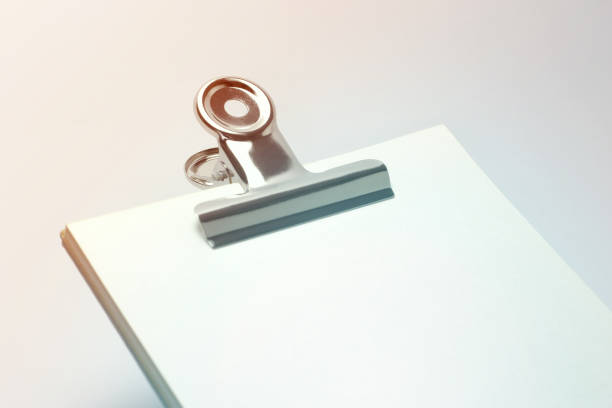 istock Metal Clip on Blank Paper 1129028959
