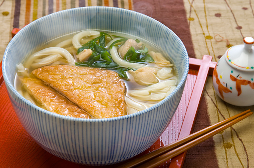 Japanese noodles called kitsuneundon are udon which soup is eaten with soup with fried tofu fried by cutting thinly the tofu.