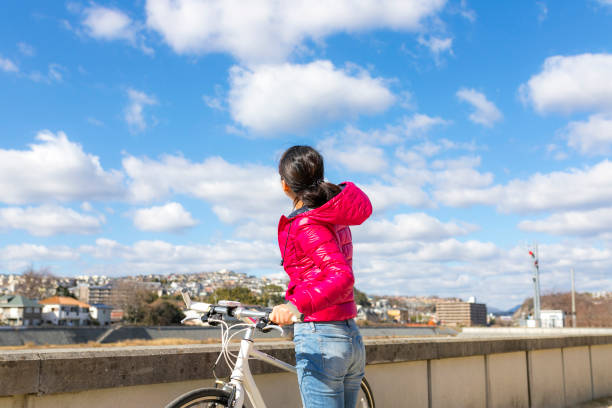 Asian female and cycling