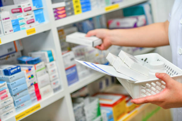istock Pharmacist filling prescription in pharmacy 1129044194