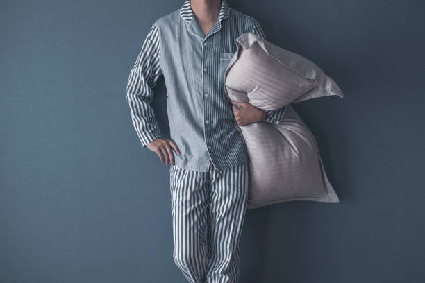 Men wearing pajamas Men wearing pajamas pyjamas stock pictures, royalty-free photos & images