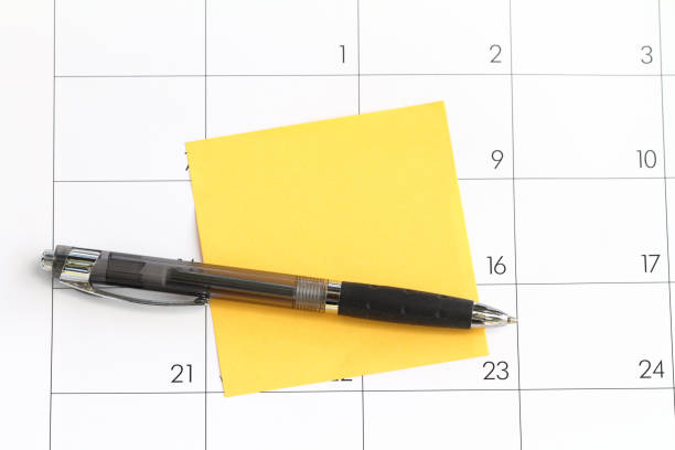 istock Calendar with sticky reminder note and pen to schedule an appointment 1129047655