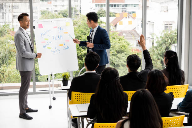 istock Businessman is explaining works to officers while training together at the office. 1129047823