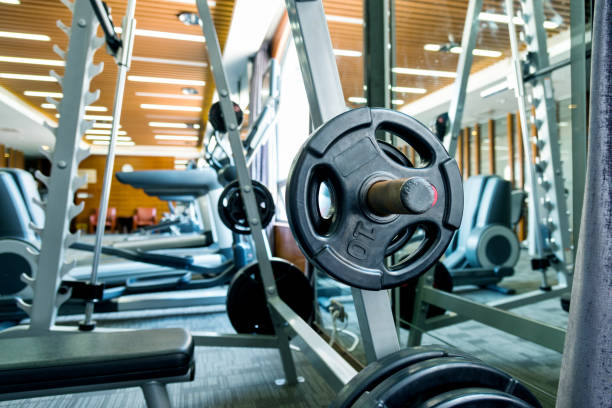 istock Metal heavy barbell laid in gym 1129049864