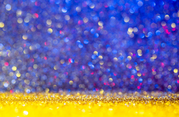 istock Glitter gold and blue multi-color background 1129049920