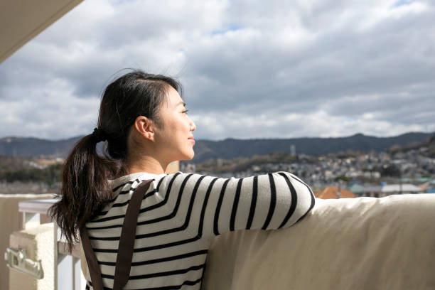 istock Asian housewife and sky 1129052243
