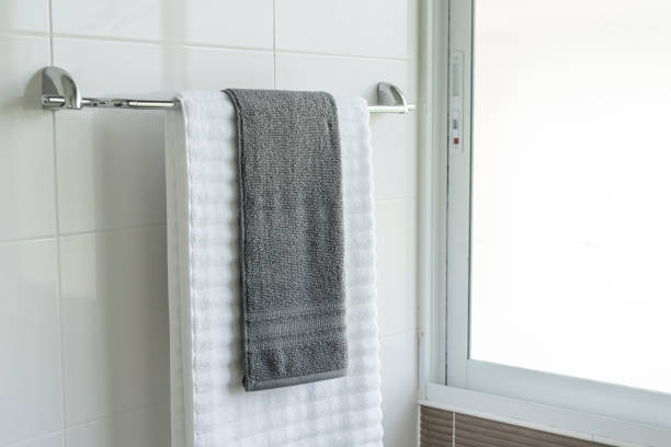 istock towels on rack in bathroom 1129053146