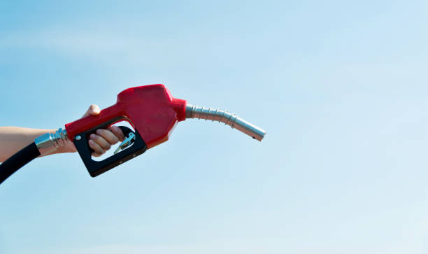 istock Human hand holding fuel pump 1129063478