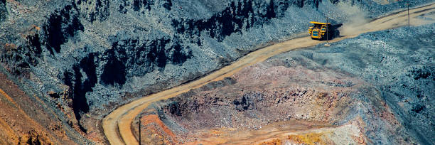 istock board iron ore pit and ore removal by road. 1129065478