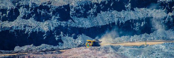 istock board iron ore pit and ore removal by road. 1129065865