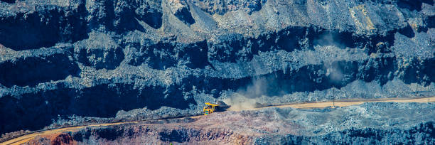 istock board iron ore pit and ore removal by road. 1129065866