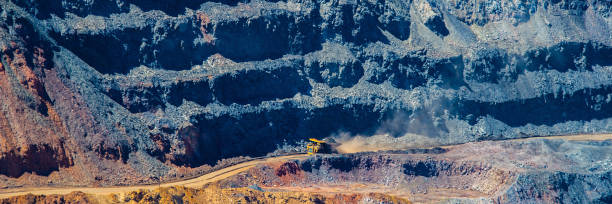 istock board iron ore pit and ore removal by road. 1129065867