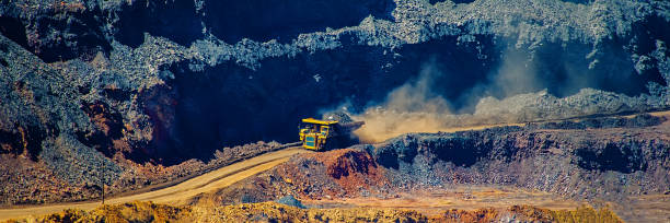 istock board iron ore pit and ore removal by road. 1129065869