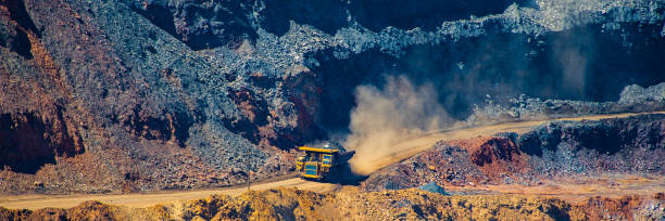 istock board iron ore pit and ore removal by road. 1129065870