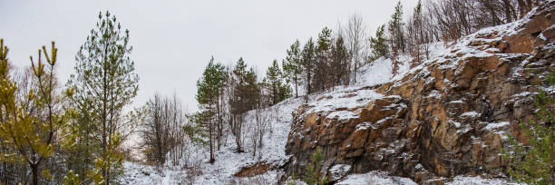istock wood and board of an abandoned old granite quarry. 1129065876