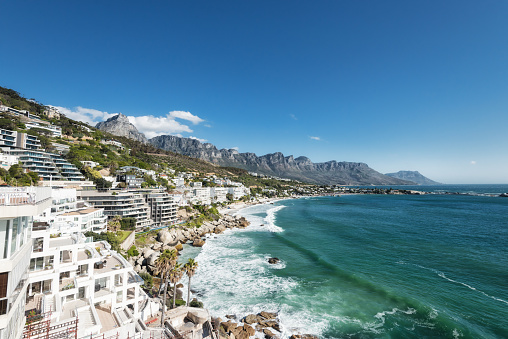 Camps Bay is a suburb from Cape Town, South Africa. Here you see Clifton with 2nd, 3rd and 4th beach ans some newly built and to be finished apartments in the foreground. Lovely place to spend vacations and holiday away from the inner city rush.