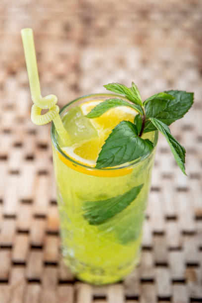 istock Mojito cocktail with lime and mint in highball glass. Copy space. 1129068215