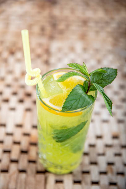 istock Mojito cocktail with lime and mint in highball glass. Copy space. 1129068327