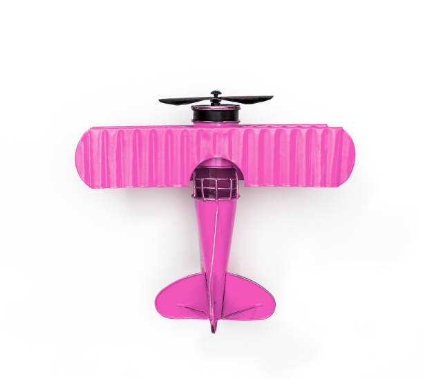 istock Pink Metal toy plane isolated on white 1129069090