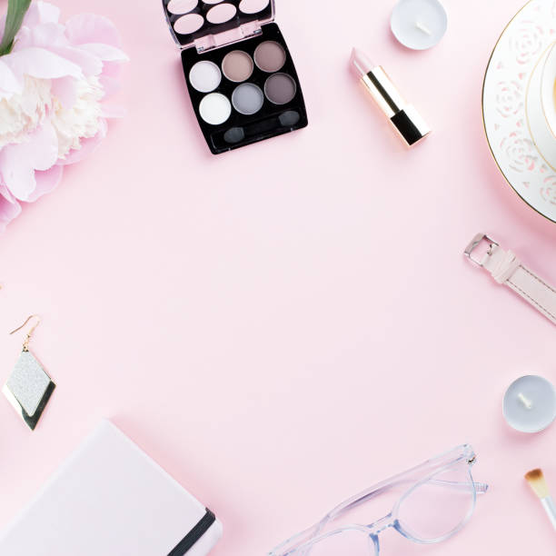 istock Beautiful cosmetics and flowers flat lay with note book, herbal tea on pastel background. 1129069160