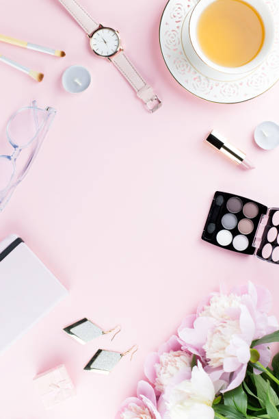 istock Beautiful cosmetics and flowers flat lay with note book, herbal tea on pastel background. 1129069186