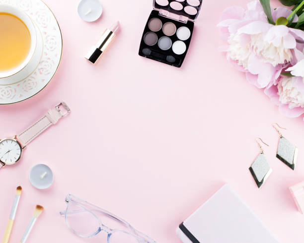 istock Beautiful cosmetics and flowers flat lay with note book, herbal tea on pastel background. 1129069222