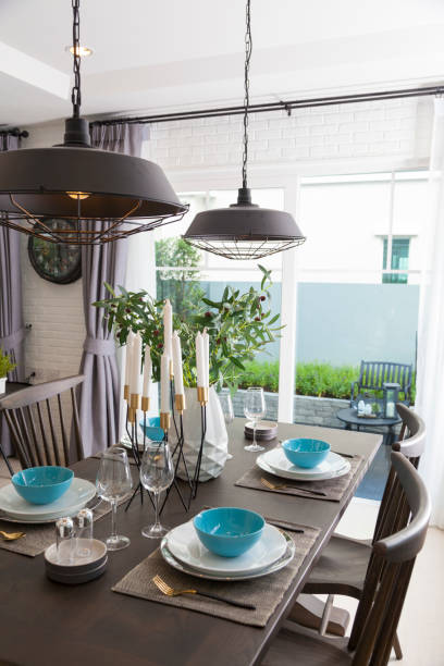 istock Modern dinning room with blue plate on wood table. 1129069238