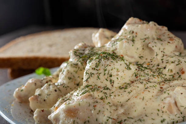 istock Stew made from chicken meat and sour cream on the plate with herbs 1129069409