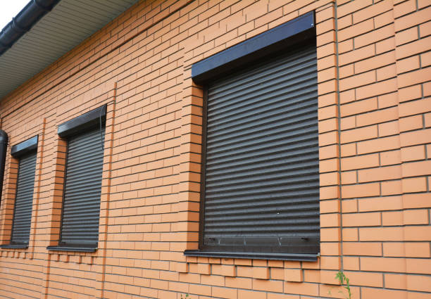 istock House Windows with rolling shutters for home protection. 1129070914